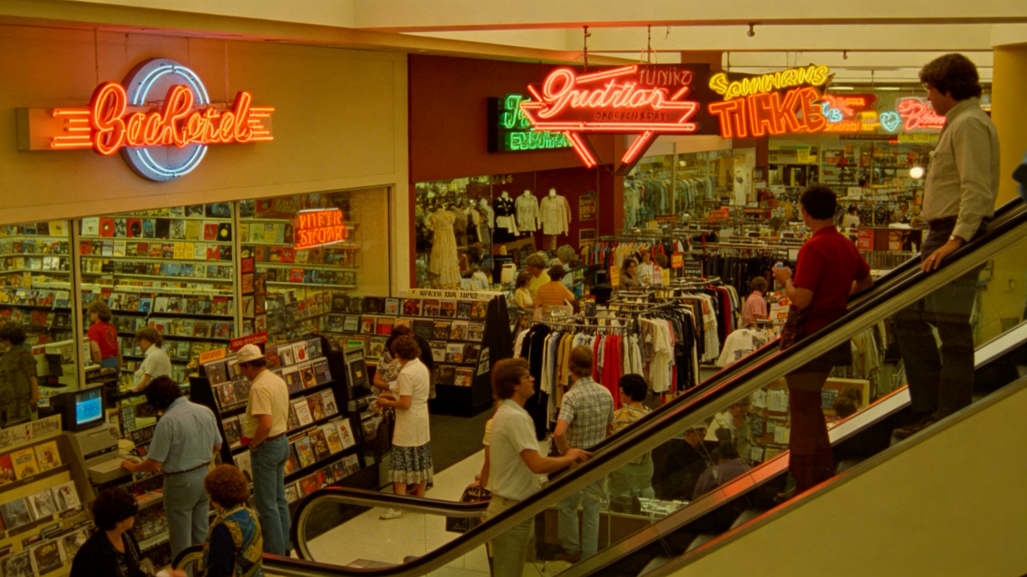 1980s shopping mall interior with neon signs and record store